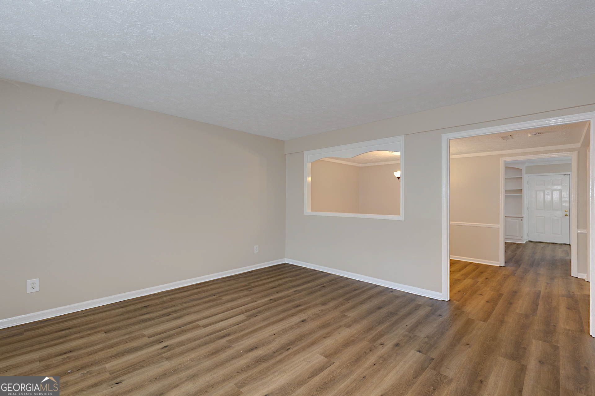 6101 River Road, Unit 2 Columbus, GA 31904 - Photo 10 of 27 a view of an empty room with wooden floor
