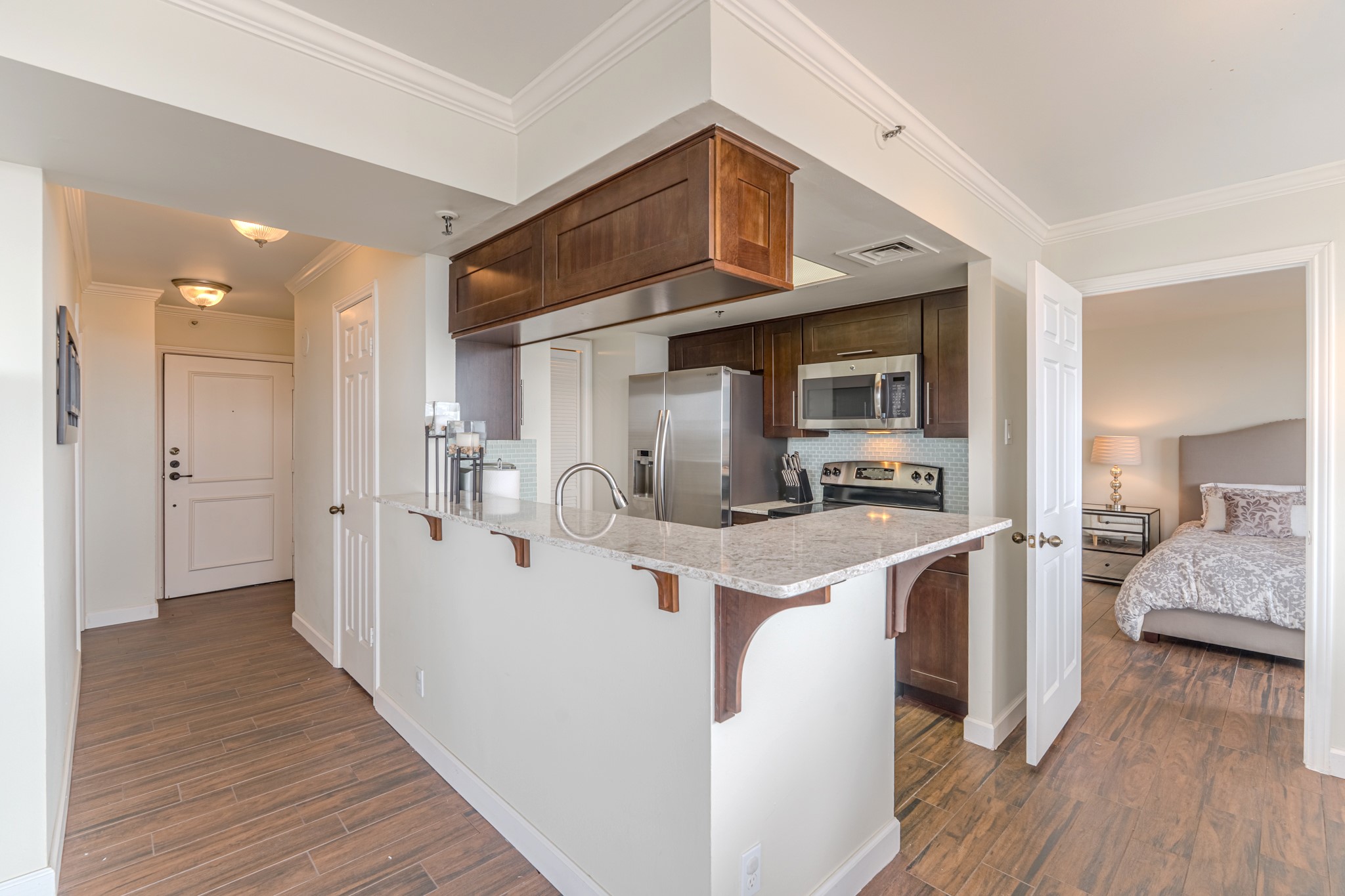 3525 Sage Road, Unit 1016 Houston, TX 77056 - Photo 28 of 42 a view of a kitchen cabinets and wooden floor
