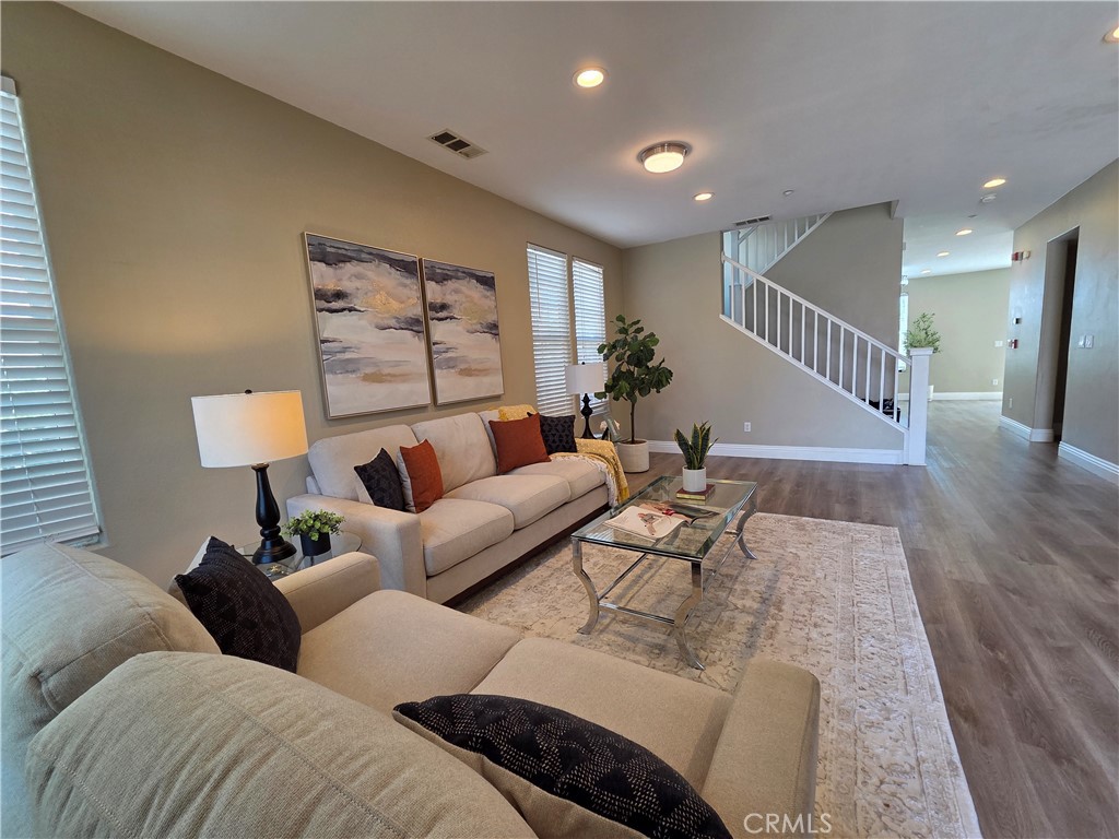20329 Red Poppy Lane Riverside, CA 92508 - Photo 5 of 24 a living room with furniture and wooden floor