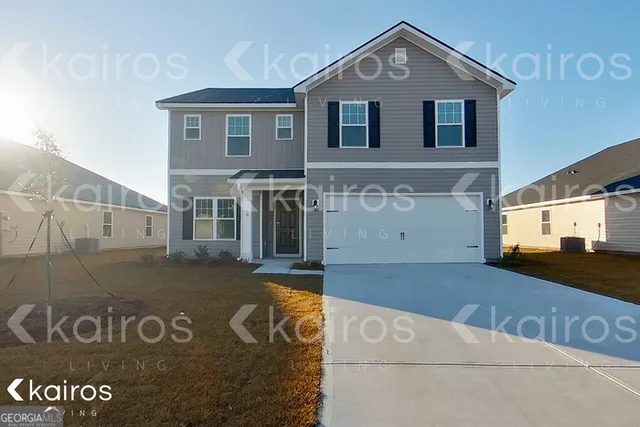 a front view of a house with parking area