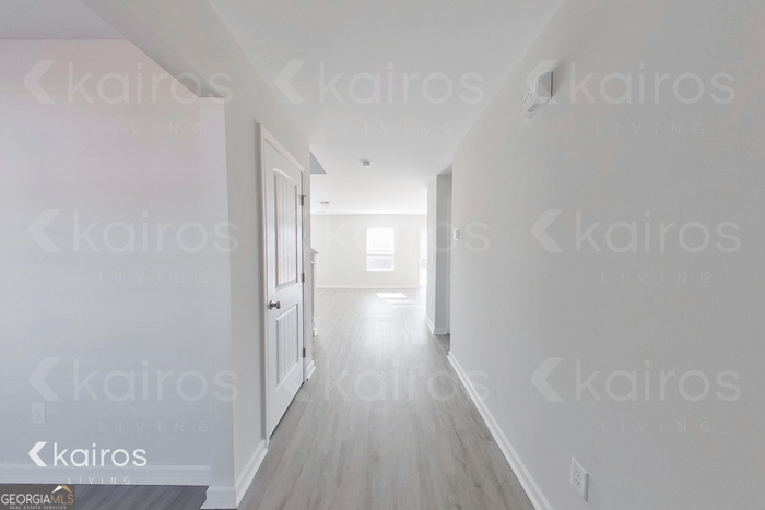 18 Duluth Drive Brunswick, GA 31525 - Photo 15 of 26 a view of a hallway with wooden floor