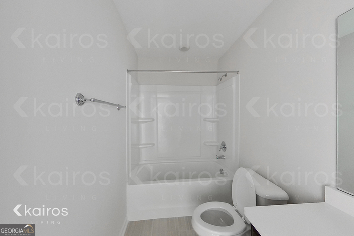 18 Duluth Drive Brunswick, GA 31525 - Photo 19 of 26 a bathroom with a tub and a shower