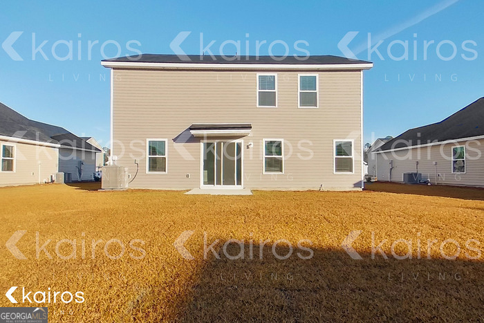 18 Duluth Drive Brunswick, GA 31525 - Photo 23 of 26 a front view of a house with a yard