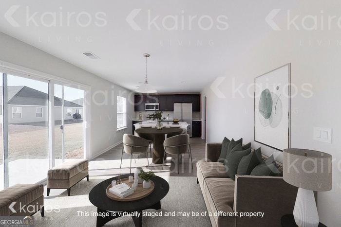 18 Duluth Drive Brunswick, GA 31525 - Photo 4 of 26 a living room with furniture a window and a table
