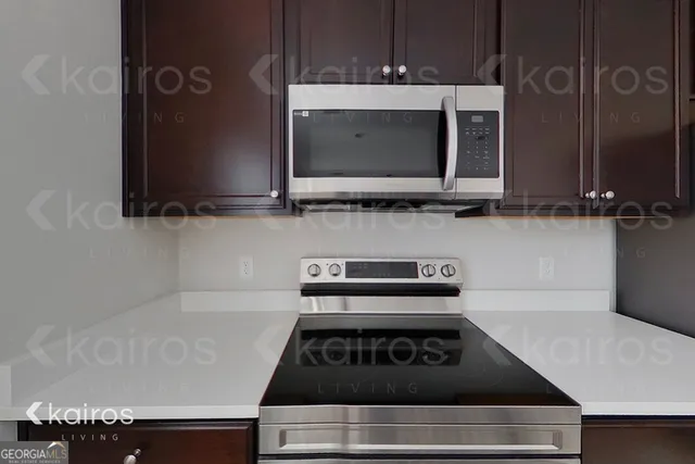a kitchen with a stove and a microwave