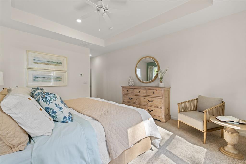 1171 Amerson Street Buckhead, GA 30625 - Photo 26 of 51 a bedroom with a bed a mirror and a table