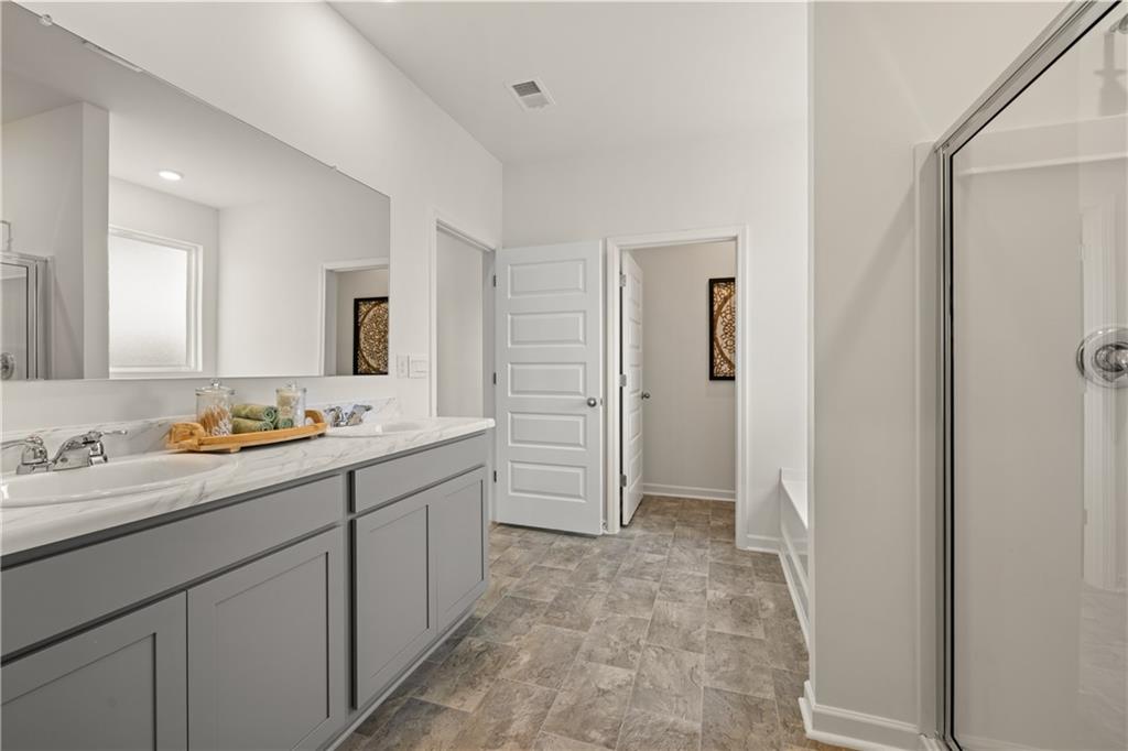1171 Amerson Street Buckhead, GA 30625 - Photo 29 of 51 a bathroom with a sink and a mirror