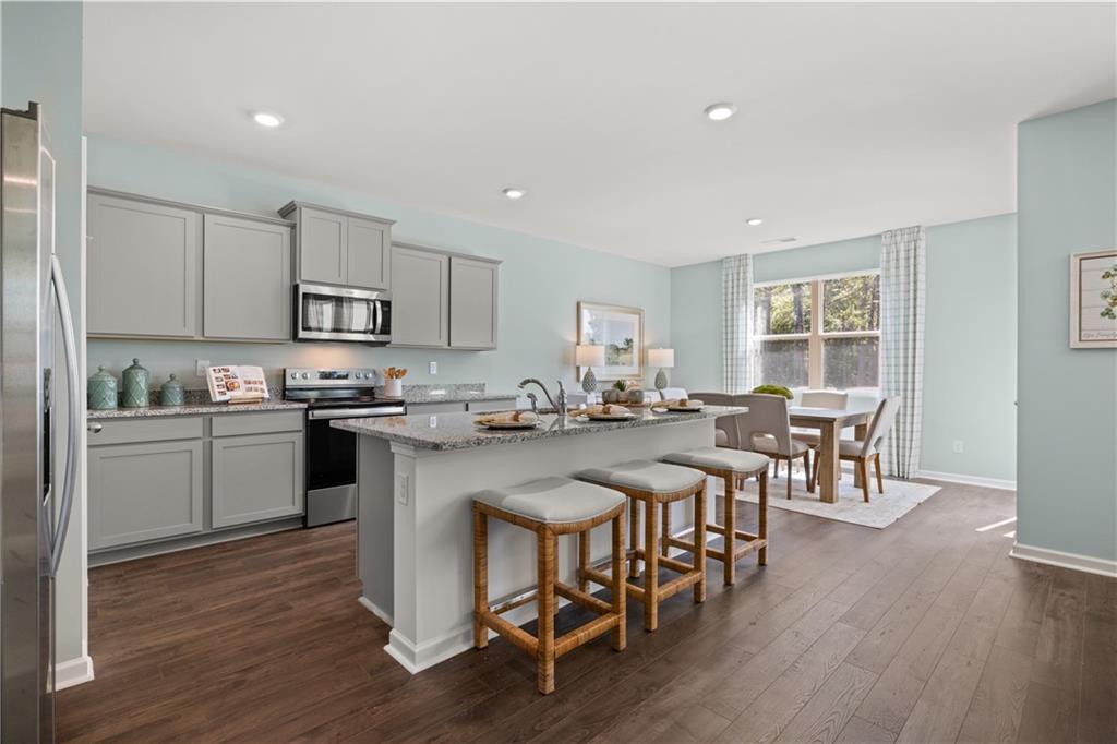 1171 Amerson Street Buckhead, GA 30625 - Photo 4 of 51 a kitchen with appliances a counter top space and a center island