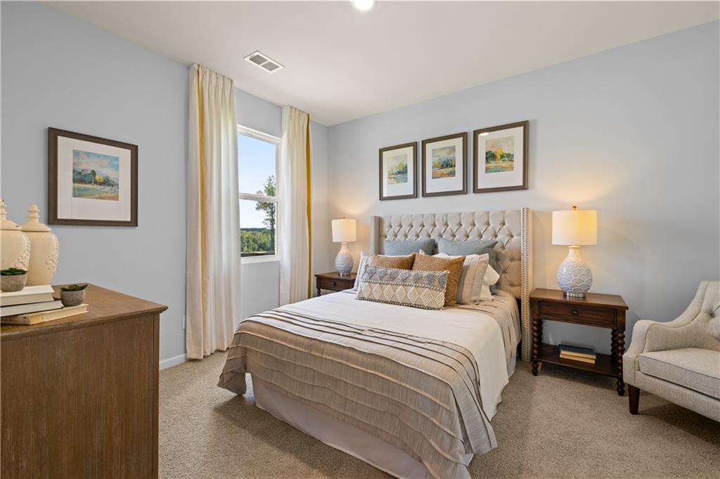 1171 Amerson Street Buckhead, GA 30625 - Photo 42 of 51 a bedroom with a bed and a couch