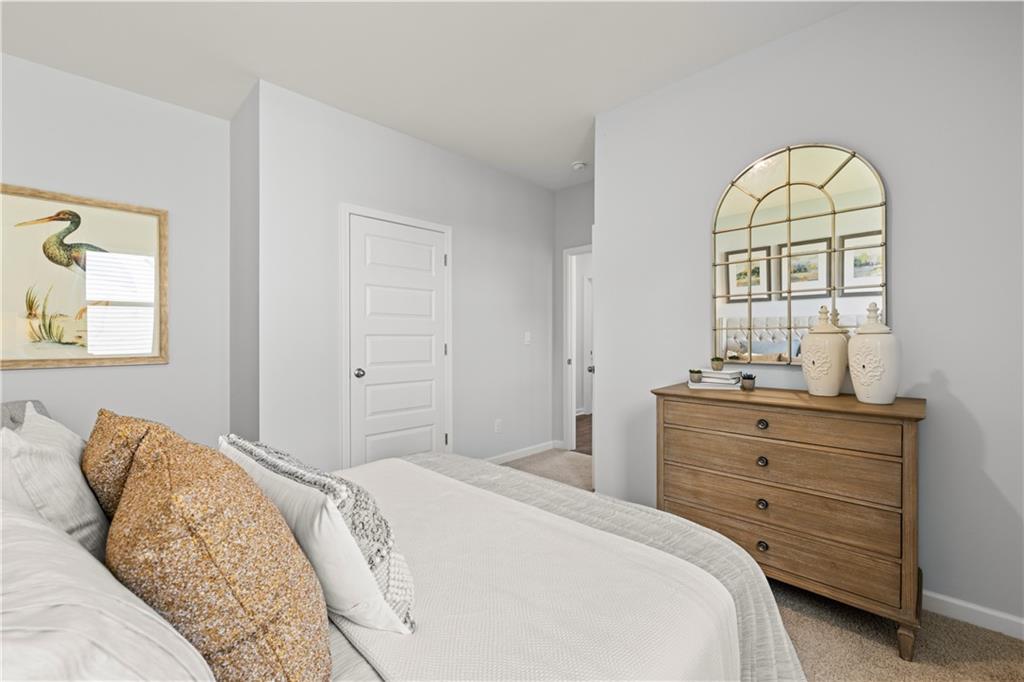1171 Amerson Street Buckhead, GA 30625 - Photo 44 of 51 a bedroom with a bed and a mirror