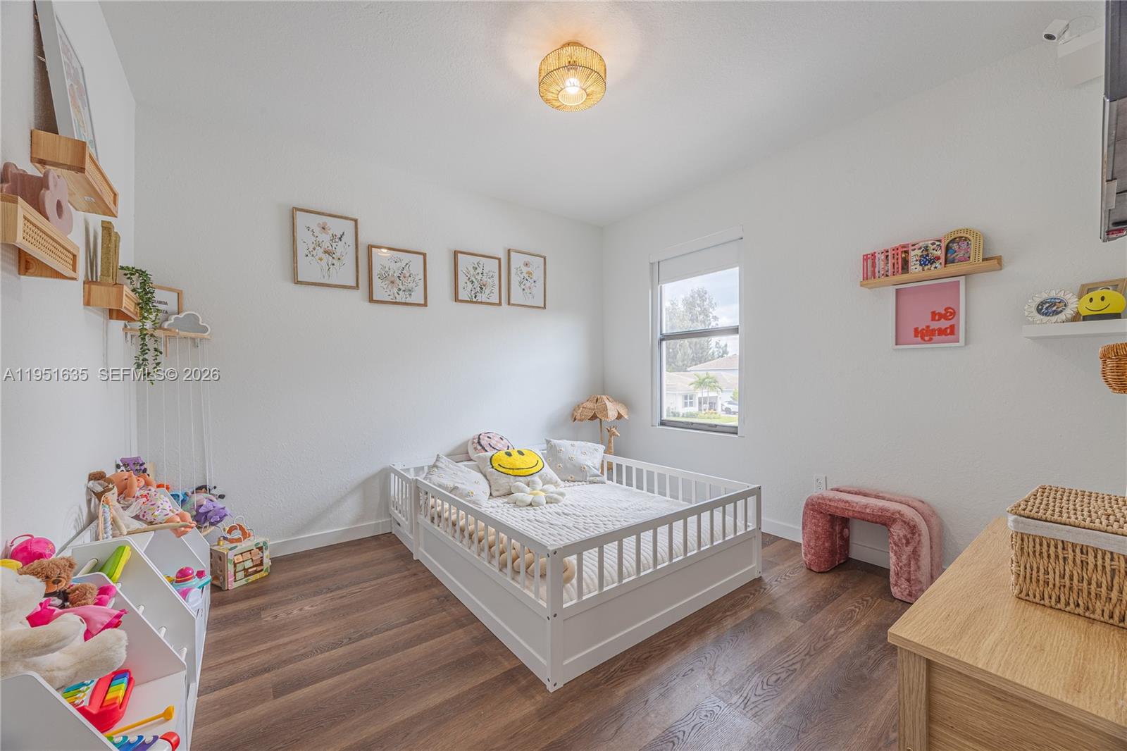7126 Rockwood Road Jupiter, FL 33458 - Photo 27 of 30 a bedroom with furniture and a wooden floor