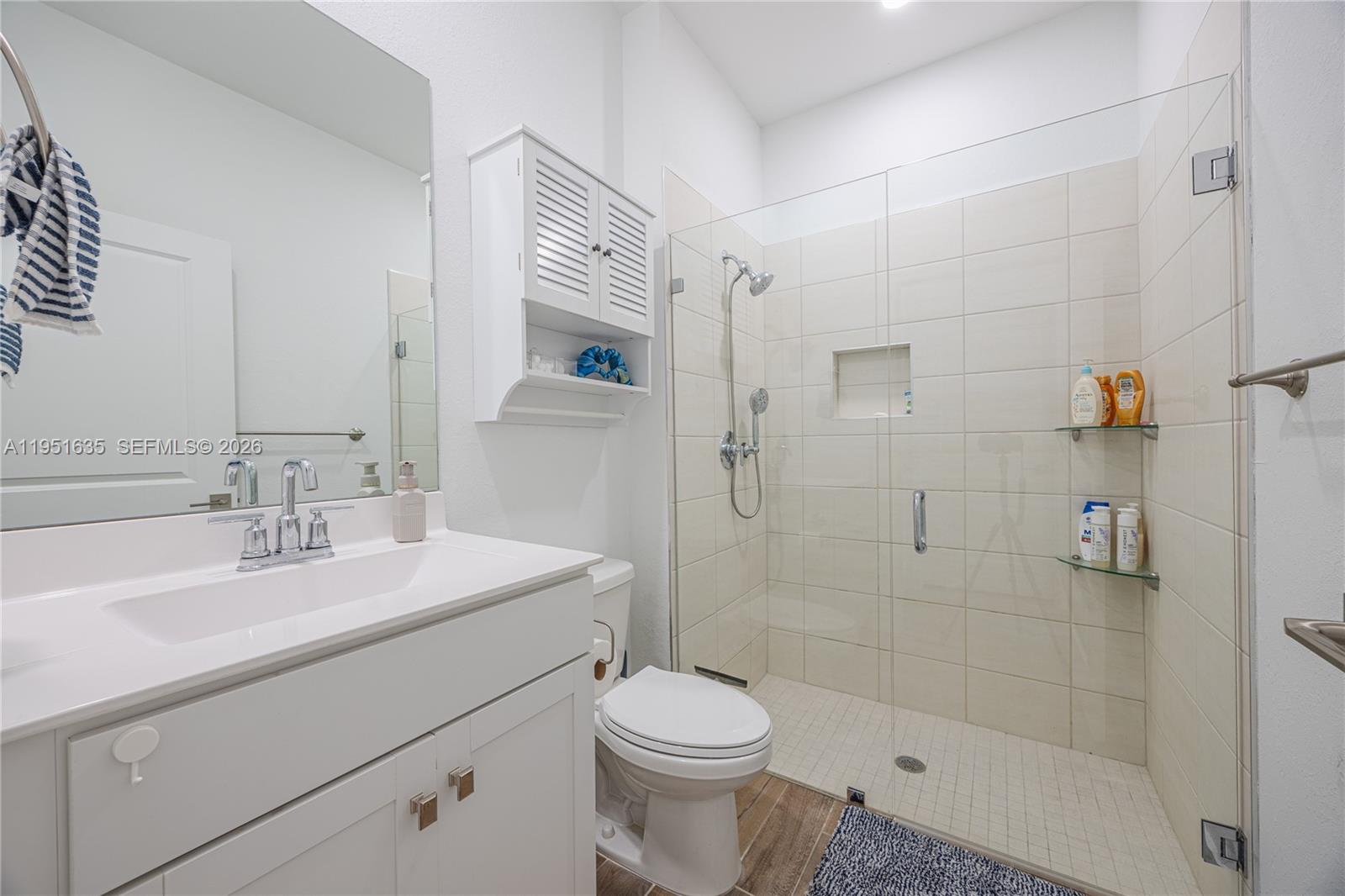 7126 Rockwood Road Jupiter, FL 33458 - Photo 10 of 30 a bathroom with a sink toilet and shower