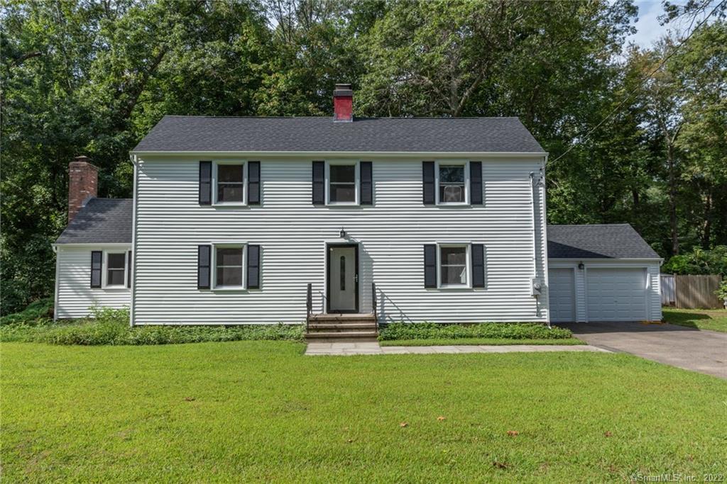 a house that has a big yard in front of it