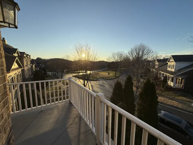 a view of balcony with furniture