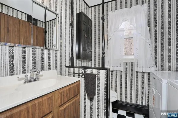 a kitchen with a sink and a refrigerator