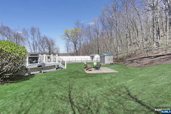 a view of a house with backyard porch and sitting area