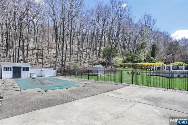 a view of street with large trees