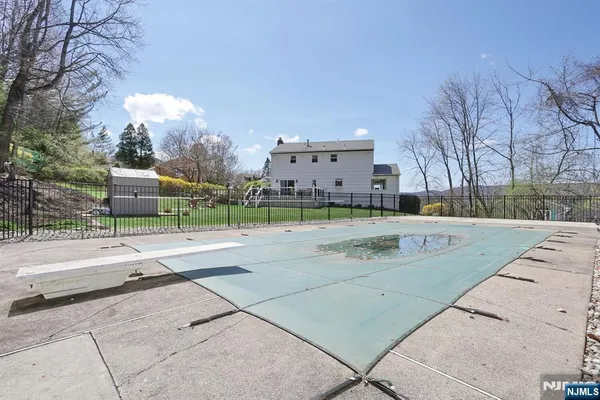 a view of a patio with table and chairs and wooden floor