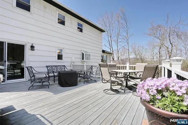 a roof deck view with a seating space