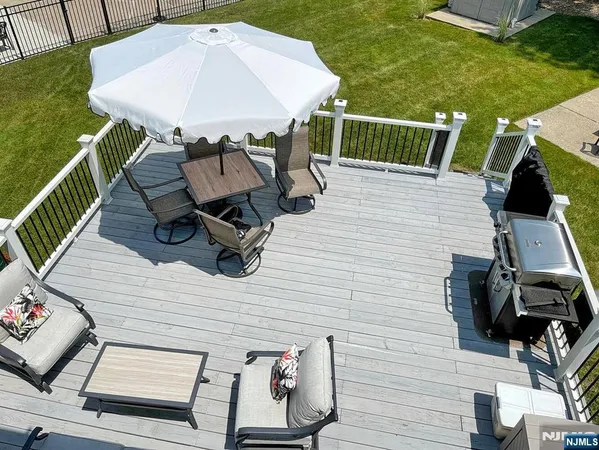a view of house with backyard and outdoor seating