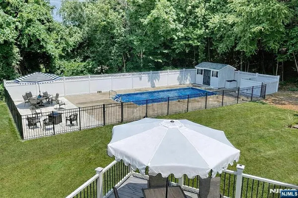 a view of yard with a table and chairs