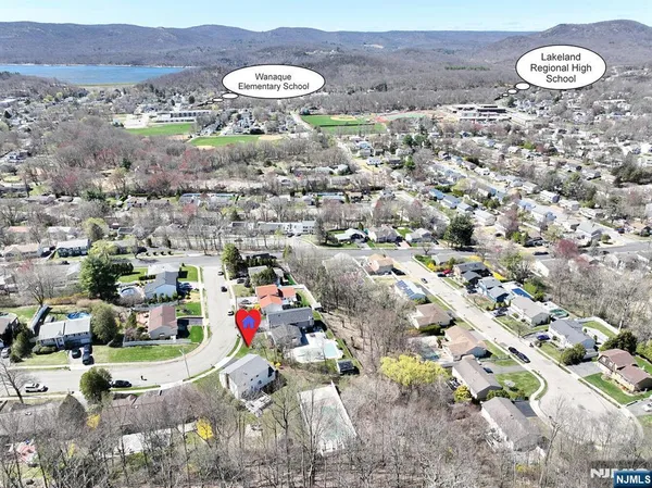 an aerial view of a house with garden