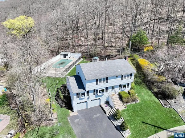 an aerial view of residential house with outdoor space