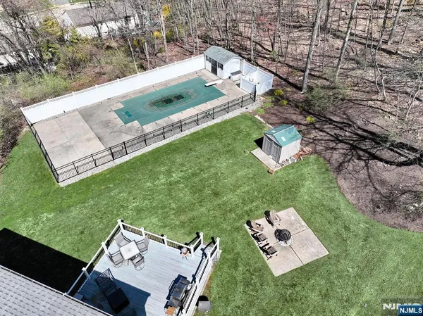 an aerial view of house with yard swimming pool and outdoor seating
