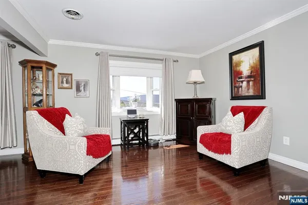 a living room with furniture rug and window