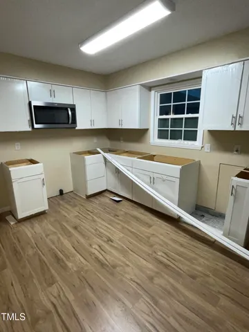 a bedroom with a bed and cabinets