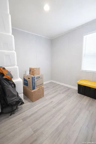 a room with wooden floor and shoes
