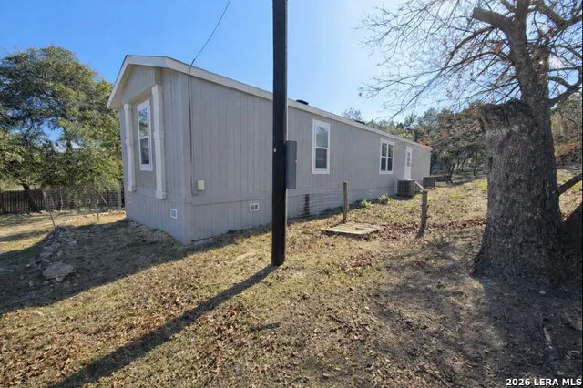 a view of a backyard of the house