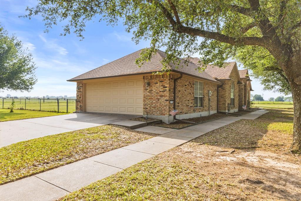 130 Blazek Road Alma, TX 75119 - Photo 5 of 34 a front view of a house with a yard