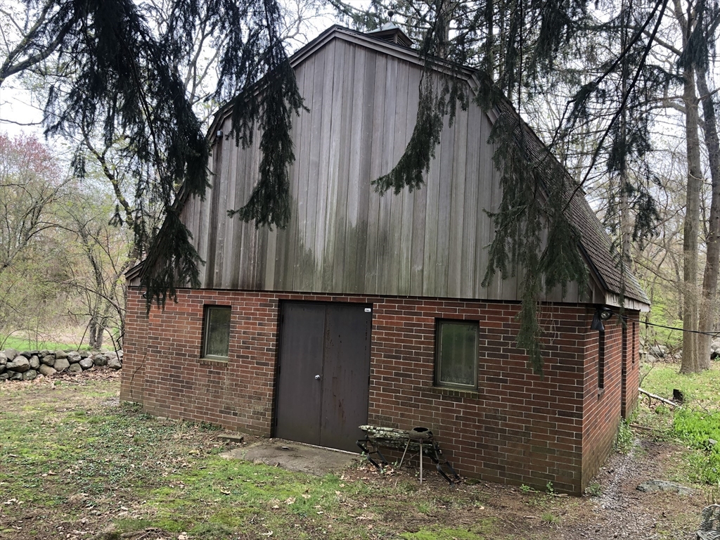 166 Spring Street Lexington, MA 02421 - Photo 4 of 8 a backyard of a house with lots of green space