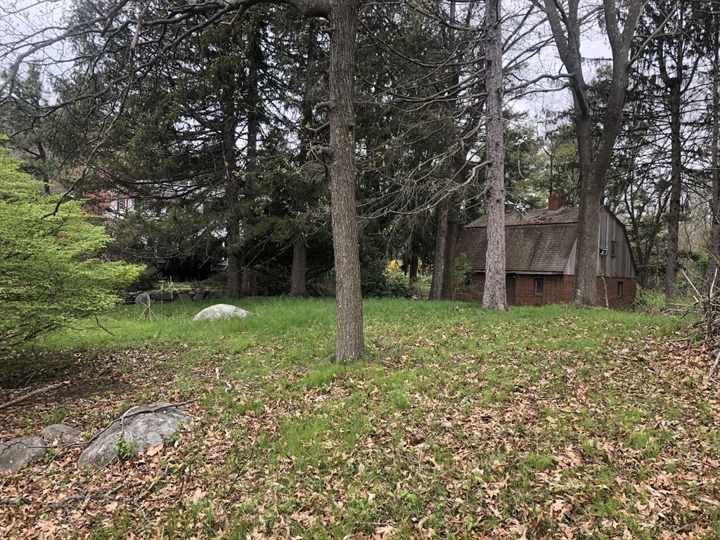 166 Spring Street Lexington, MA 02421 - Photo 5 of 8 a view of a house with a yard