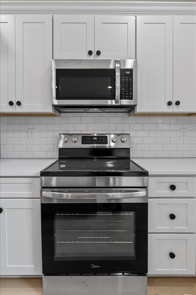 591 Fire Tower Road Dickson, TN 37055 - Photo 11 of 24 a stove top oven sitting inside of a kitchen