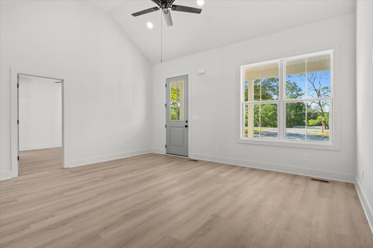 591 Fire Tower Road Dickson, TN 37055 - Photo 14 of 24 wooden floor in an empty room with a window