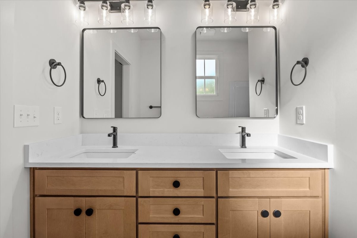 591 Fire Tower Road Dickson, TN 37055 - Photo 17 of 24 a bathroom with double vanity sinks and a mirror