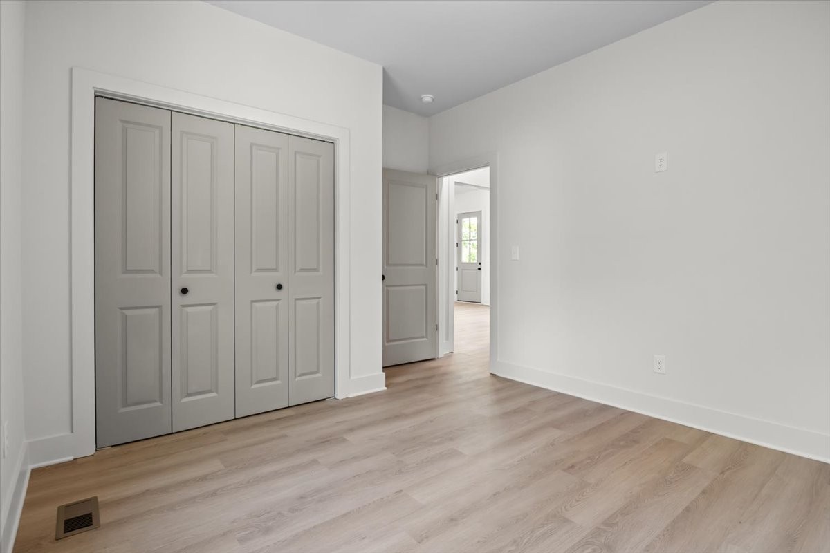 591 Fire Tower Road Dickson, TN 37055 - Photo 20 of 24 a view of an empty room with wooden floor