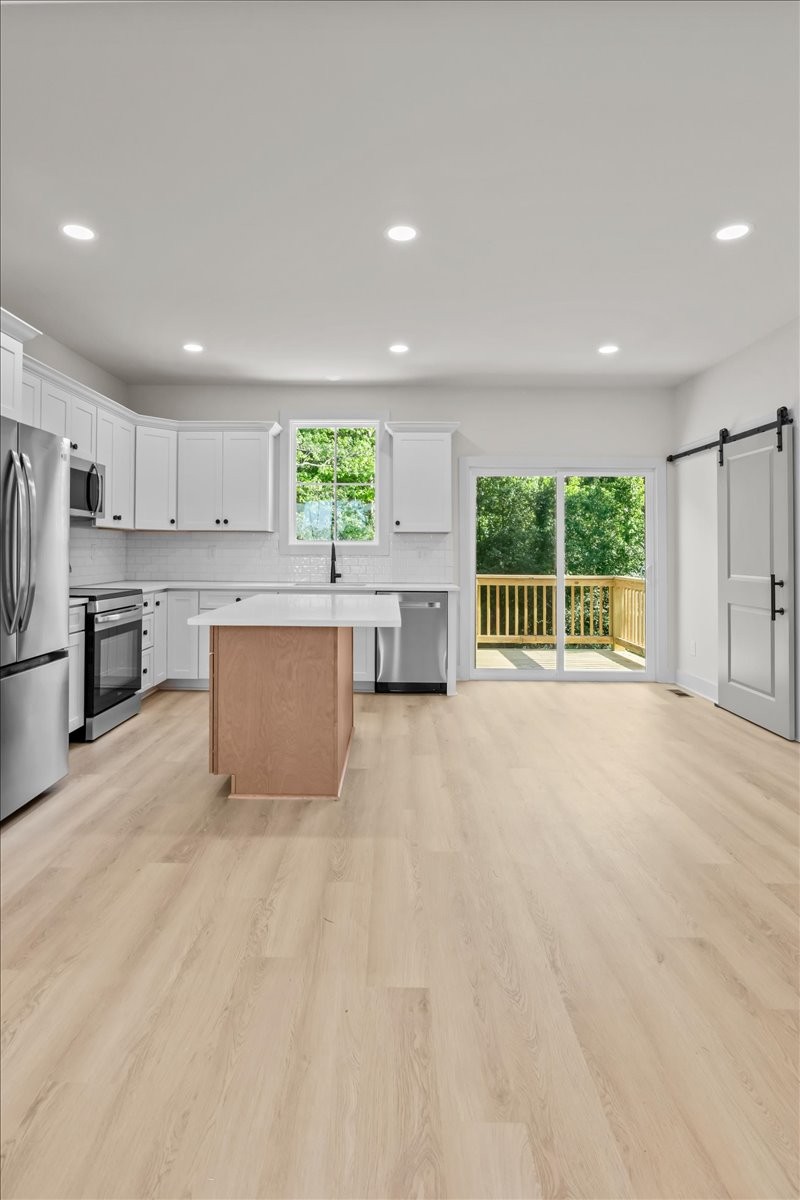 591 Fire Tower Road Dickson, TN 37055 - Photo 8 of 24 a view of kitchen with furniture and a refrigerator