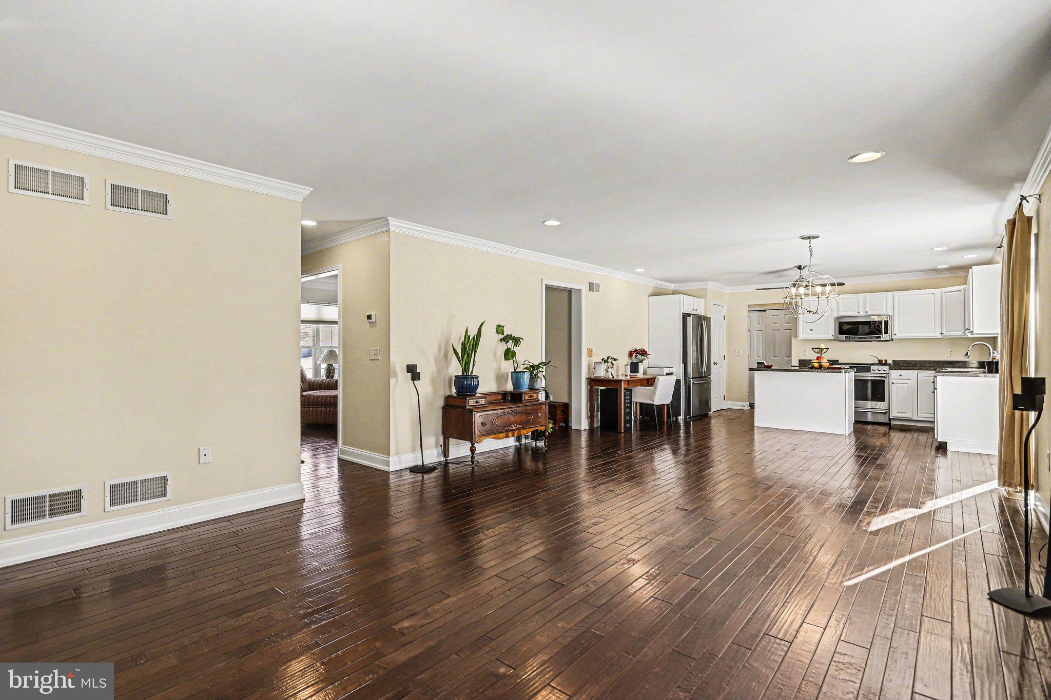 207 Edenderry Way Enola, PA 17025 - Photo 9 of 40 Spacious open-concept living area with warmth.