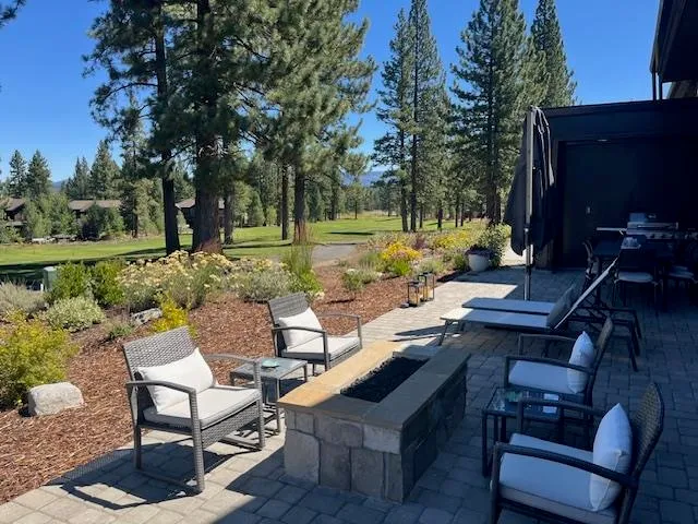 a view of a backyard with sitting area