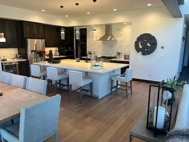 a living room with stainless steel appliances kitchen island granite countertop furniture and kitchen view