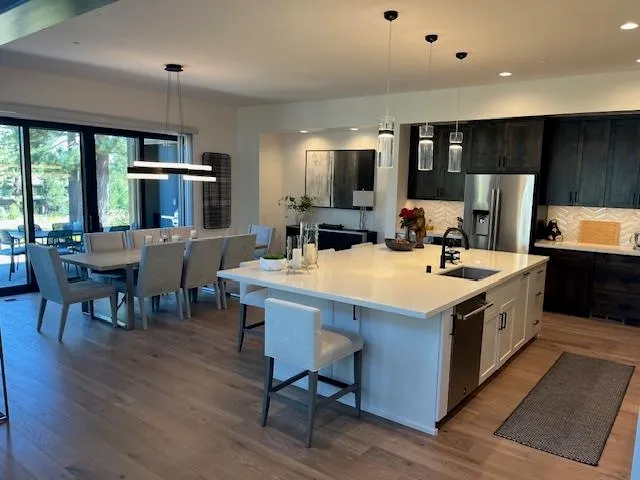 a kitchen with a stove and a refrigerator