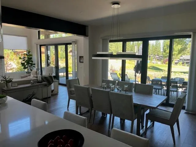 a view of a dining room with furniture and window