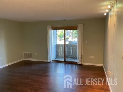 a view of wooden floor and brick walls