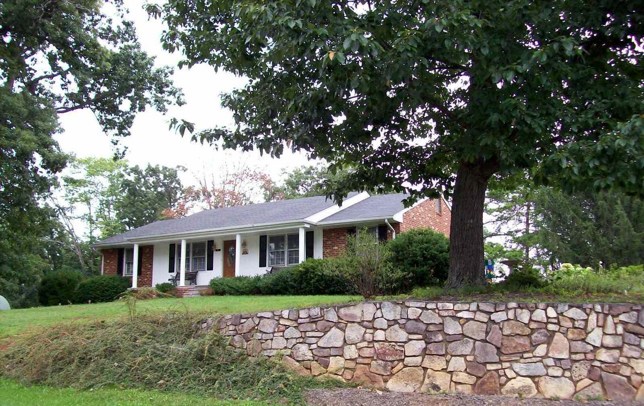16 Persimmon Court Blue Ridge, VA 24064 - Photo 1 of 10 a front view of a house with a garden