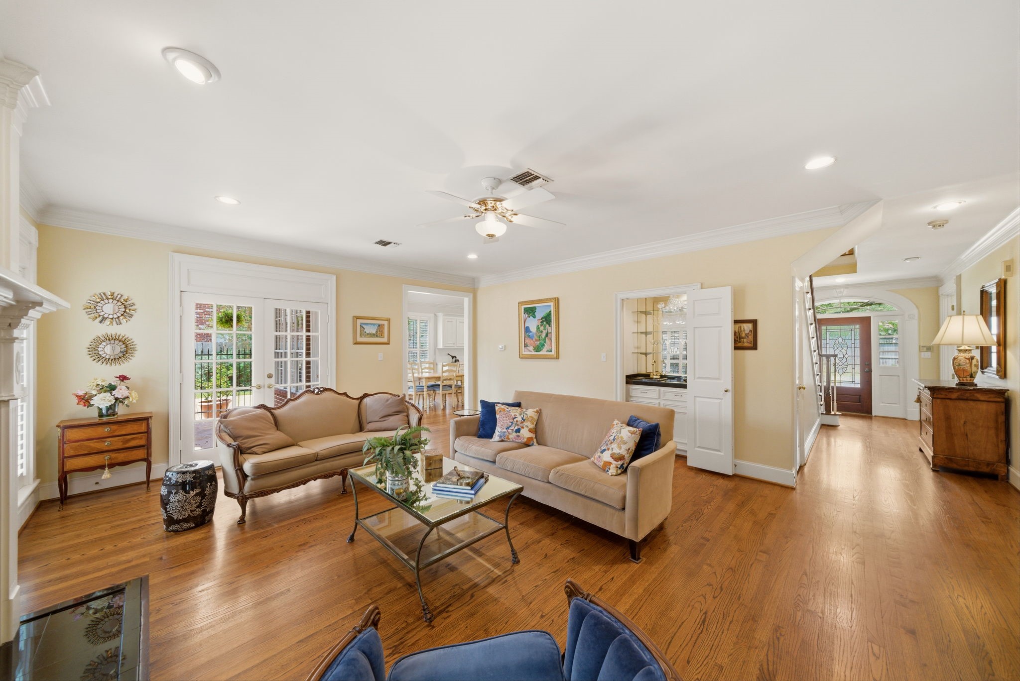 3 Martin Lane Spring Valley Village, TX 77055 - Photo 5 of 32 This inviting living area has hardwood floors and wet bar. Use storage/coat closet under the stair case!