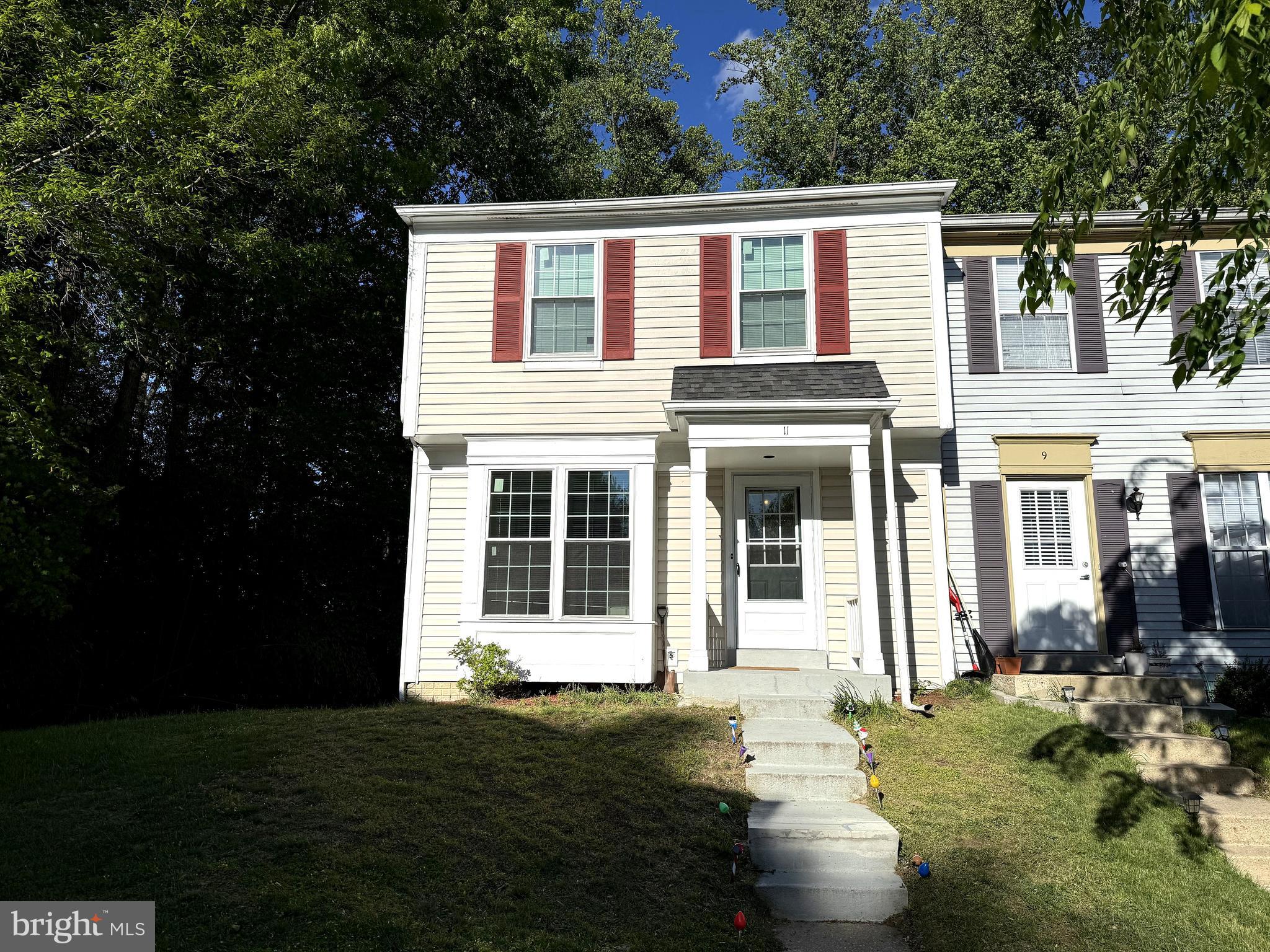 11 Wimbledon Court Silver Spring, MD 20906 - Photo 1 of 21 a front view of a house with a garden