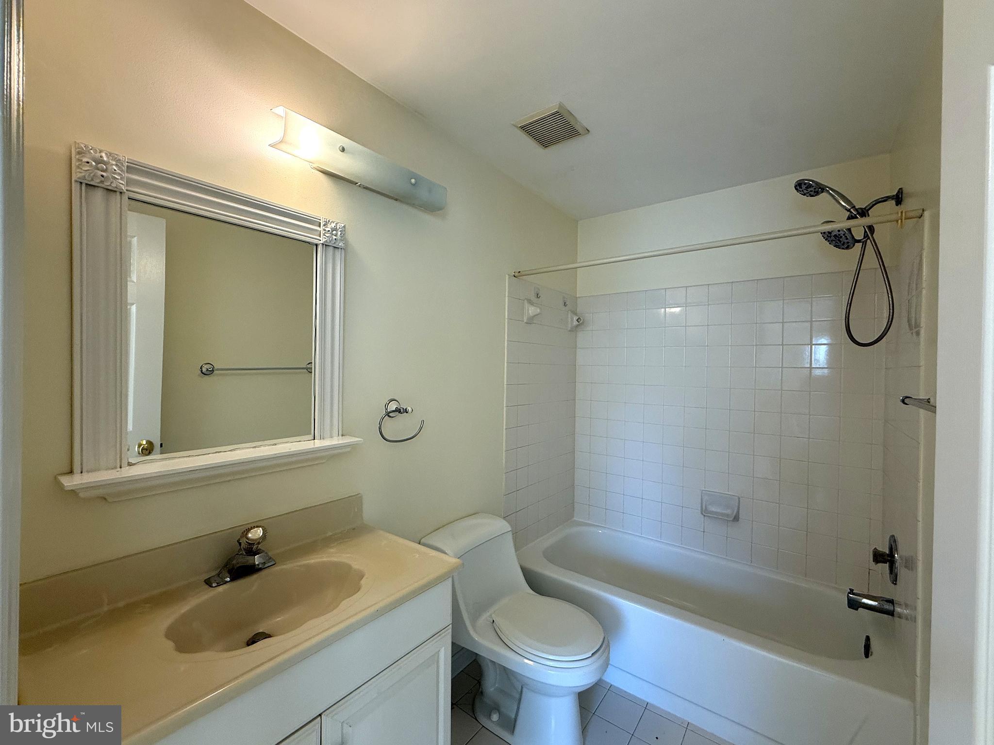 11 Wimbledon Court Silver Spring, MD 20906 - Photo 13 of 21 a bathroom with a sink mirror toilet and bathtub